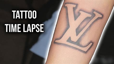 louis vuitton tattoo hand|Louis Vuitton tattoo meaning gang.